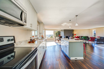 Bright interior of kitchen with large kitchen island