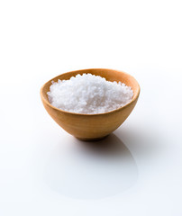 Fototapeta na wymiar Sea Salt in a wooden bowl on white background