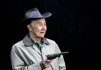 portrait of an old man with a gun