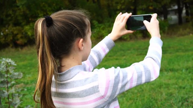 Teen girl doing photos of nature