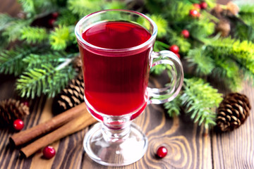 Glass cup with christmas hot punch for winter Cinnamon berrry wine Copy space