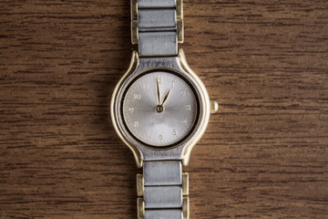 Wristwatch on wooden background