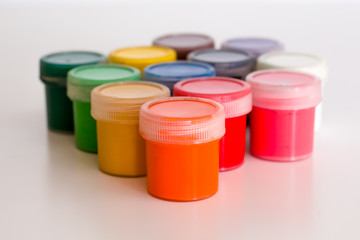 several closed jars with colorful gouache