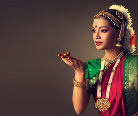 Fototapeta premium Beautiful indian girl dancer of Indian classical dance bharatanatyam . Culture and traditions of India.