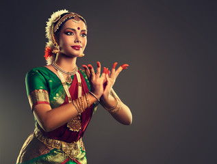 Naklejka premium Beautiful indian girl dancer of Indian classical dance bharatanatyam . Culture and traditions of India.