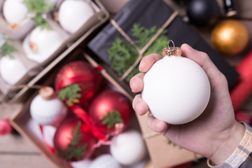 Christmas / New Year set with hand holding christmas ball and do