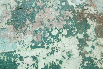 Green wall with peeling plaster