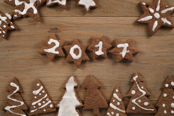 gingerbread chocolate cookies over wood table forms composition
