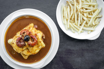 francesinha traditional meat cheese spicy sauce grilled sandwich