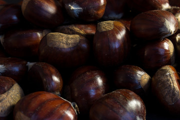 Close up of chestnuts in a dark background