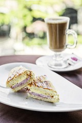 cheese ham toasted croissant and latte coffee breakfast snack se