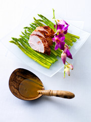 Haute cuisine, tandoori chicken breast with asparagus