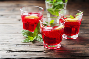 Aperitif with campari, mint and lemon