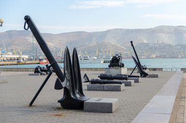 Old cannon and anchors on the Shore Promenade of Admiral Serebry