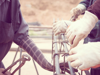 Obraz premium Construction workers are installing steel rods in reinforced con