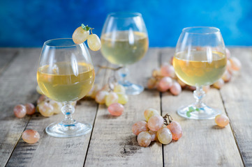 White table grapes on a rustic wooden background