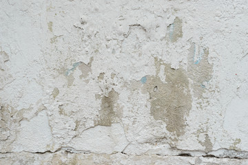 Wall fragment with scratches and cracks