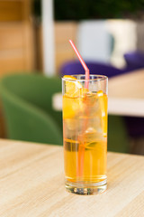 glass of lemonade on table in a cafe