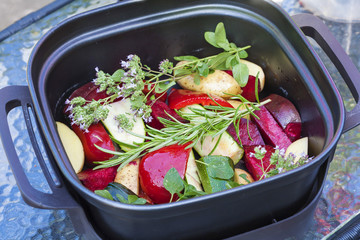 Raw vegetable with herbs ready for cooking in oven