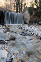 Fototapeta premium Waterfall and stream at Loutra Pozar of Aridaia in Macedonia, Greece