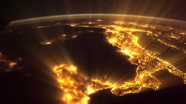 Shining Earth and Italy seen from ISS. Elements of this video furnished by NASA. Italy lit night lights