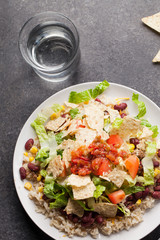 Taco Salad stacked on a bed of brown rice top view
