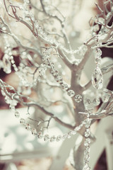 Fototapeta na wymiar elegantly tasteful decorated with crystals wedding decorate tree, summer, vintage, glamor