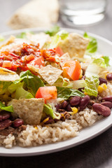 Taco Salad stacked on a bed of brown rice