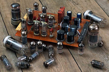 radio lamps and transistors on a wooden table