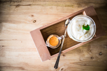 Coffee Espresso and fruit Smoothies Served on a wooden tray.