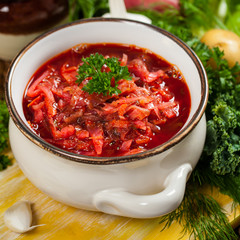 Borscht. Traditional Russian and Ukrainian national food - red beet soup. Selective focus.