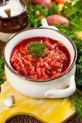 Borscht. Traditional Russian and Ukrainian national food - red beet soup. Selective focus.
