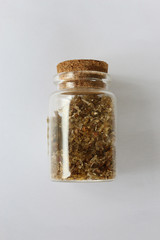 Natural aromatic incense musk in bottle isolated on a white background