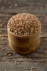 buckwheat groats on wooden surface