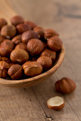 hazelnuts on wooden surface