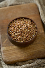 buckwheat groats on wooden surface