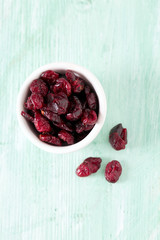 cranberry on wooden surface