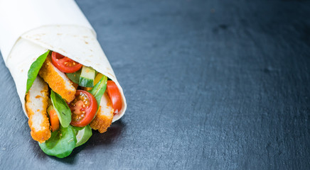 Chicken Wraps (selective focus) on a slate slab