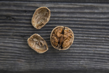 nuts in shells  on a old wooden table.