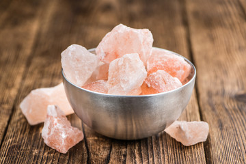Wooden table with a portion of pink Salt