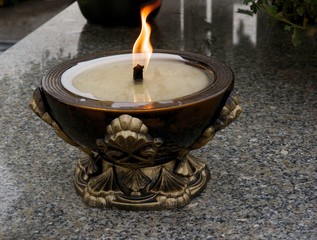 burning candel on tomb