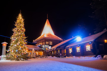 Santa Claus' Village in Finland surrounded by Christmas trees
