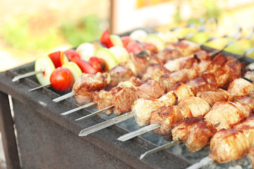 Fresh tasty barbecue with vegetables in brazier outdoors