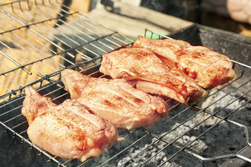Fresh meat on grill outdoors