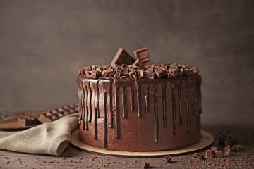 Tasty chocolate cake on table