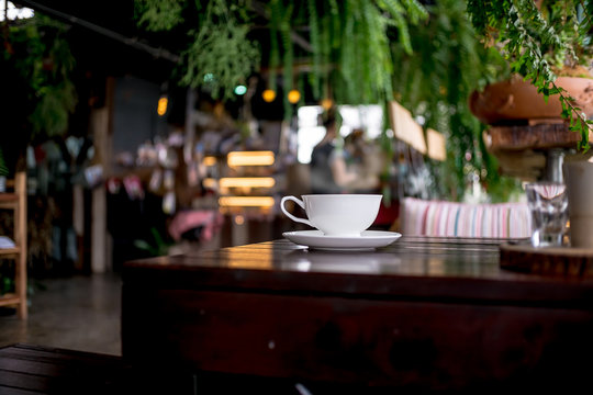 Coffee Cup And Tea On A Wooden Table In Coffee Shop - LOFT Style