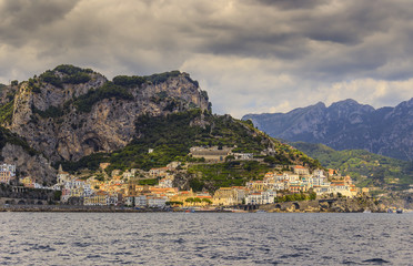 Amalfi coast (Costiera Amalfitana):panoramic view of Positano town.Italy (Campania)..In the background the beach and the tourist port.