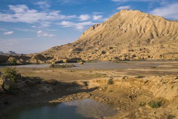 Landscape, dry cracked land and mountain