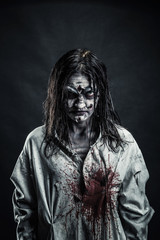 Zombie woman with bloody face
