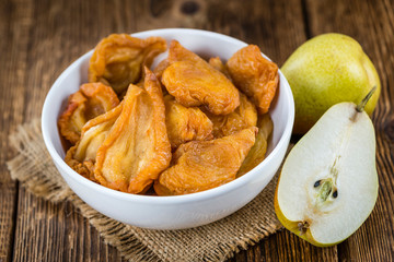 Wooden table with dried Pears (selective focus)